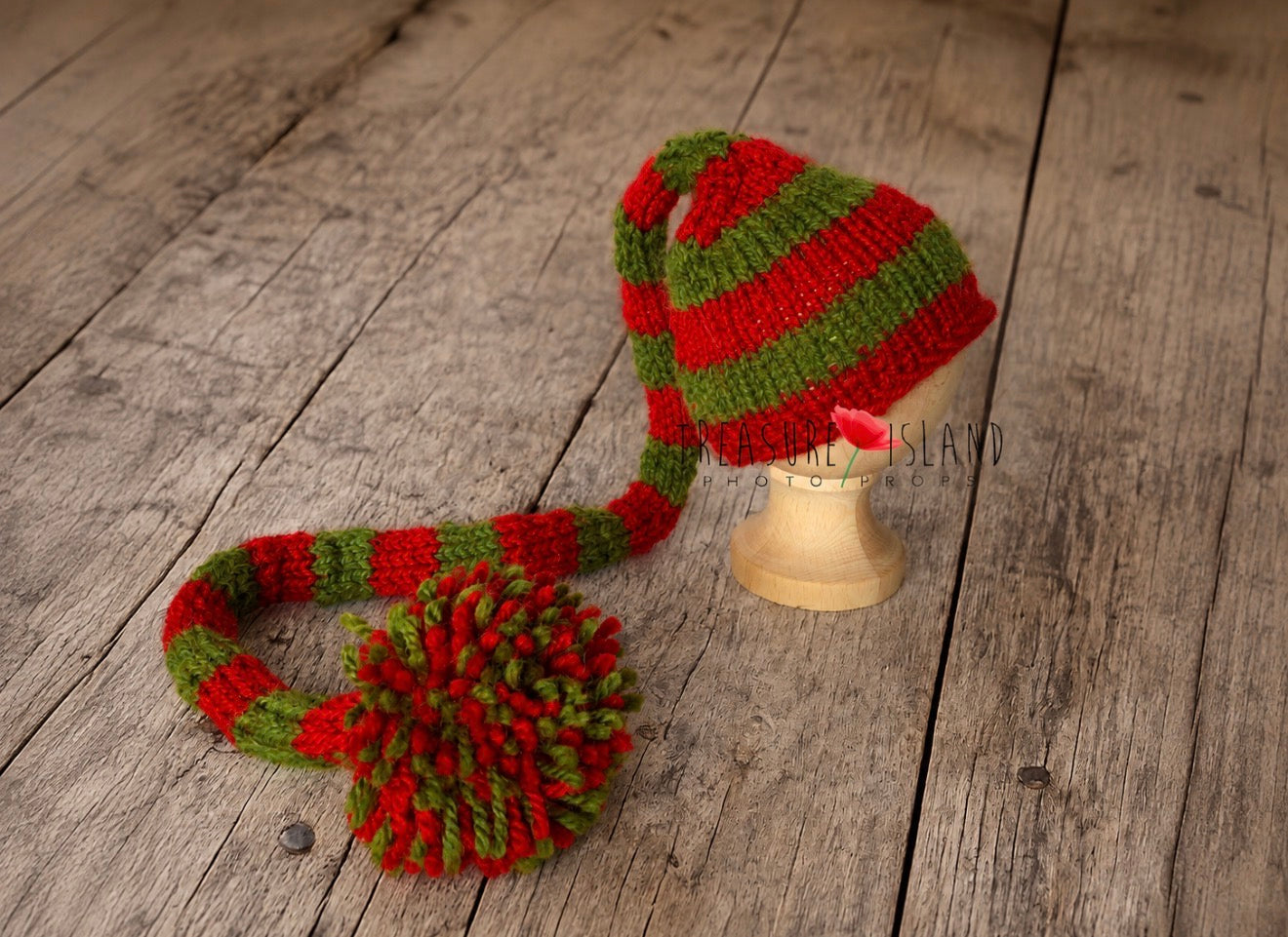 Hand-knitted red and green long tail Elf hat with large coordinating pom pom for newborn Christmas photo sessions.