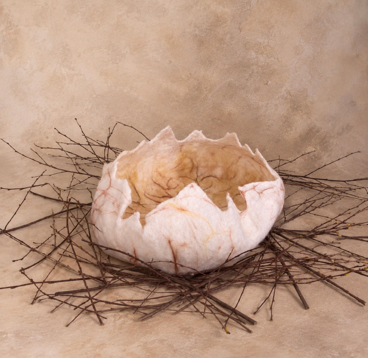 Lightly reinforced hand-felted dinosaur eggshell for newborn photography