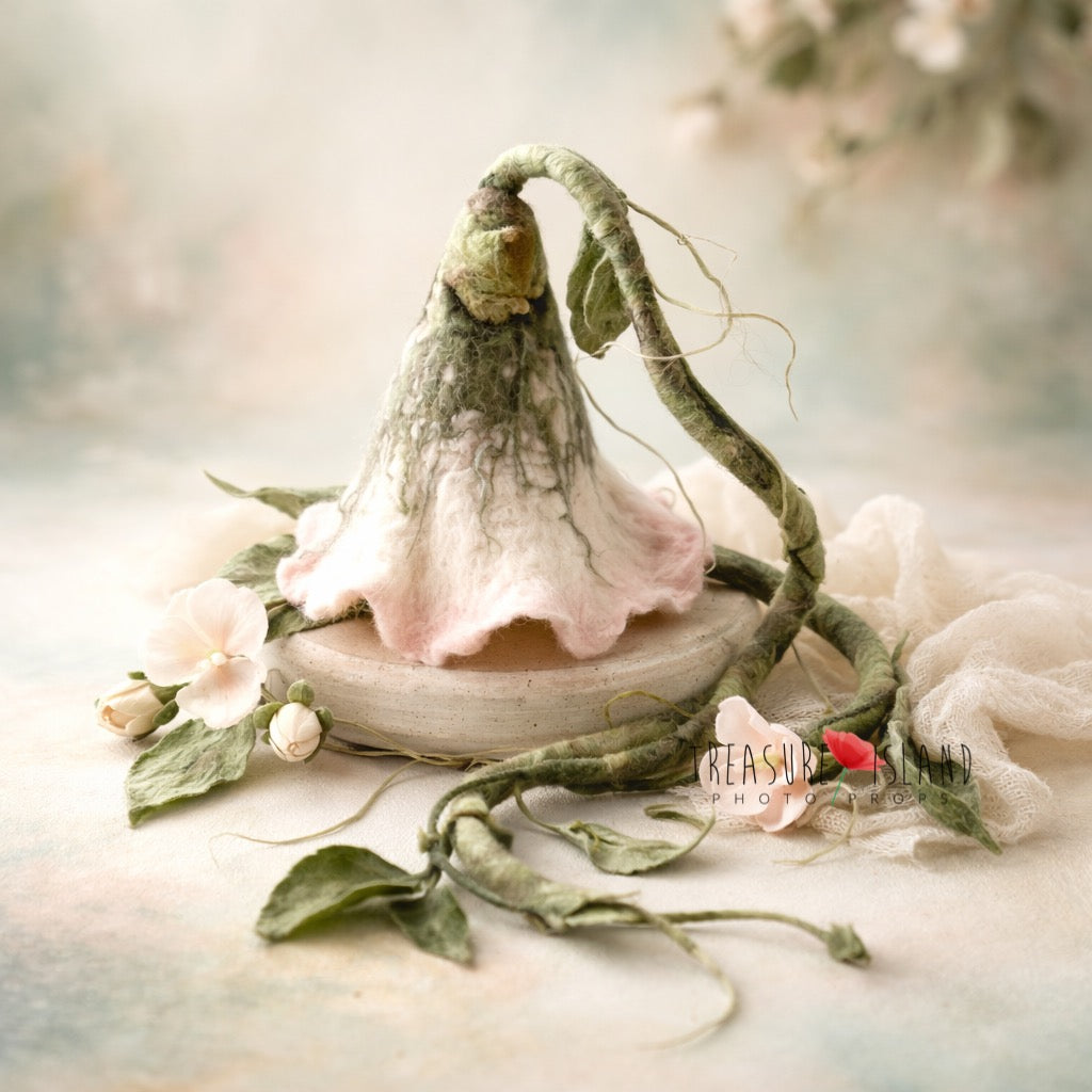 Handmade felted bonnet with delicate floral details in organic pastel colors- photo props