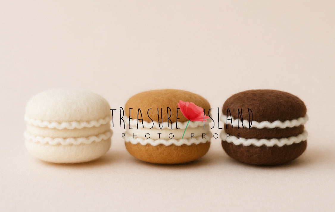 Three hand-felted Christmas macaron photography props in snow white, gingerbread and chocolate brown with cream filling