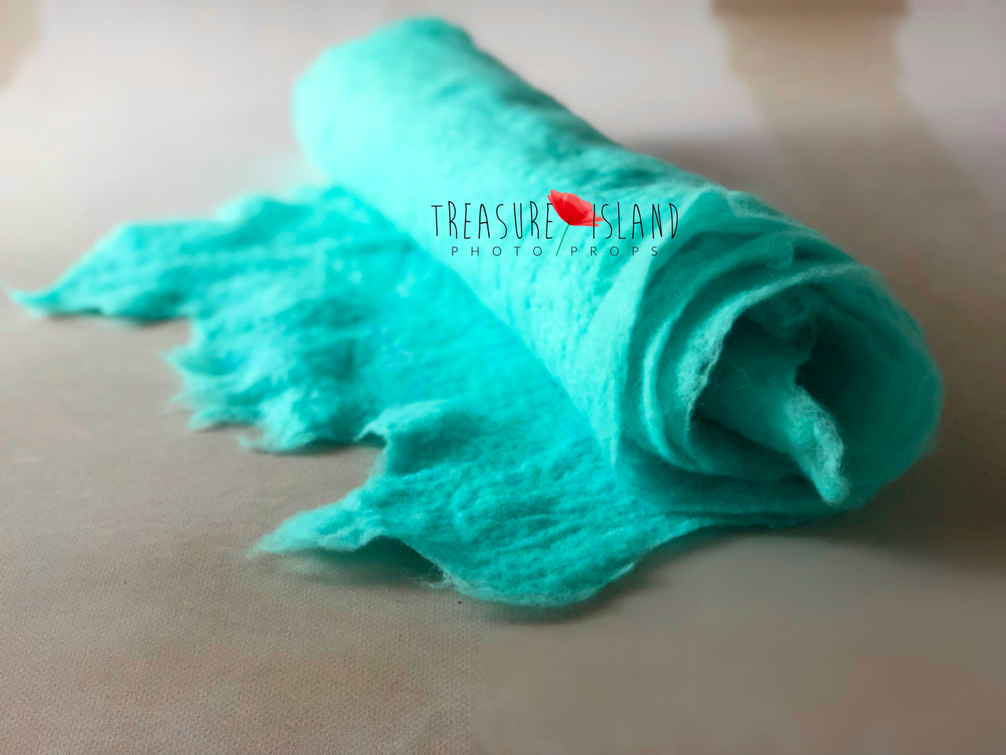 Ocean turquoise  extra long felted wool wrap shown rolled