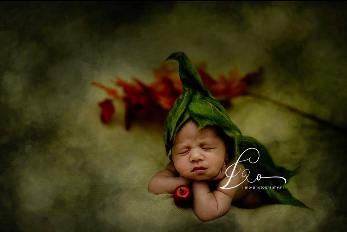 Botanical newborn styling with felted green leaf bonnet and matching diaper cover
