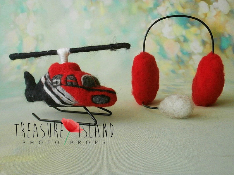 Hand-felted rescue helicopter with red newborn pilot headphones