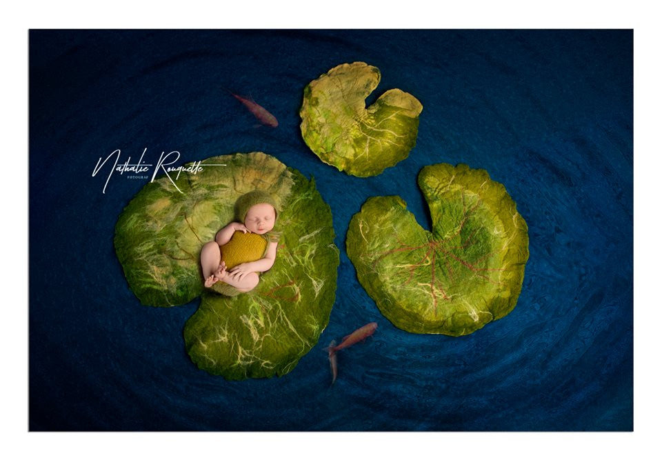 Hand-felted water lily leaves in three sizes styled as botanical posing props for newborn photography