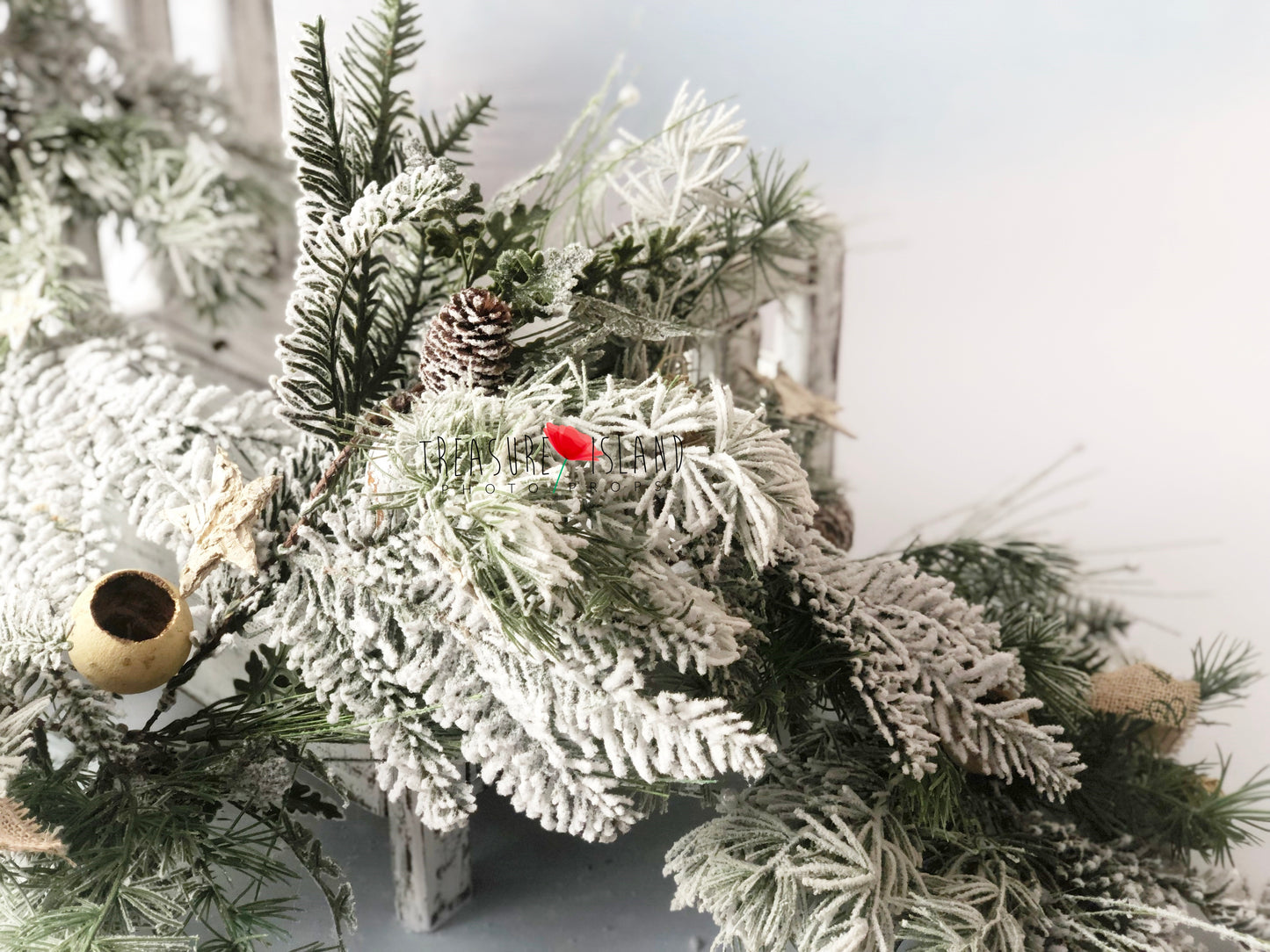Rich frosted evergreen Christmas garland with snowy branches and pinecones for winter photography