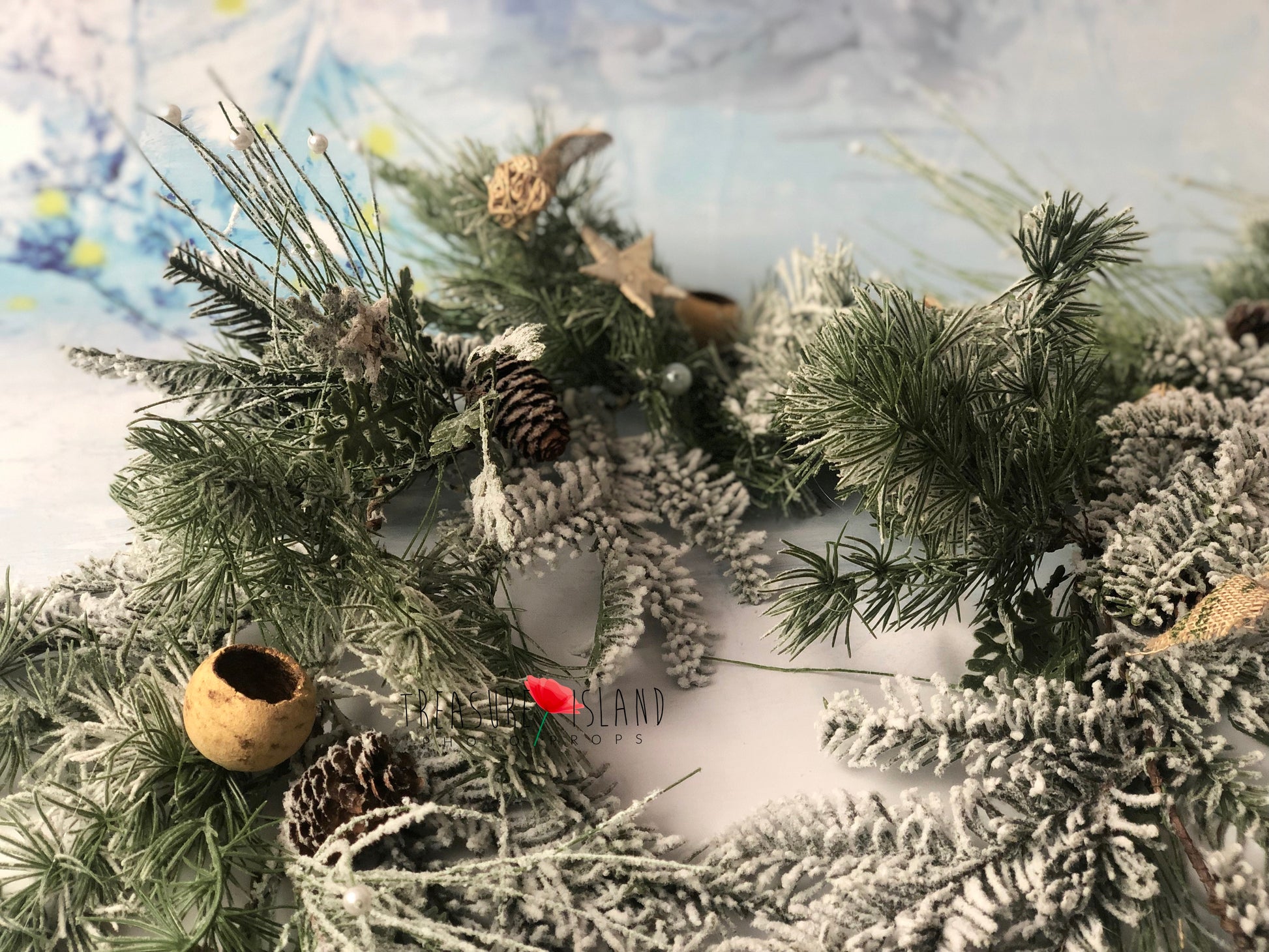 Handcrafted snowy Christmas garland with richly layered frosted greenery for holiday photography