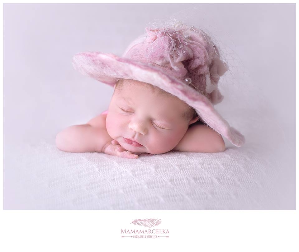 Newborn portrait styled with handmade pink felted floral hat and delicate veil