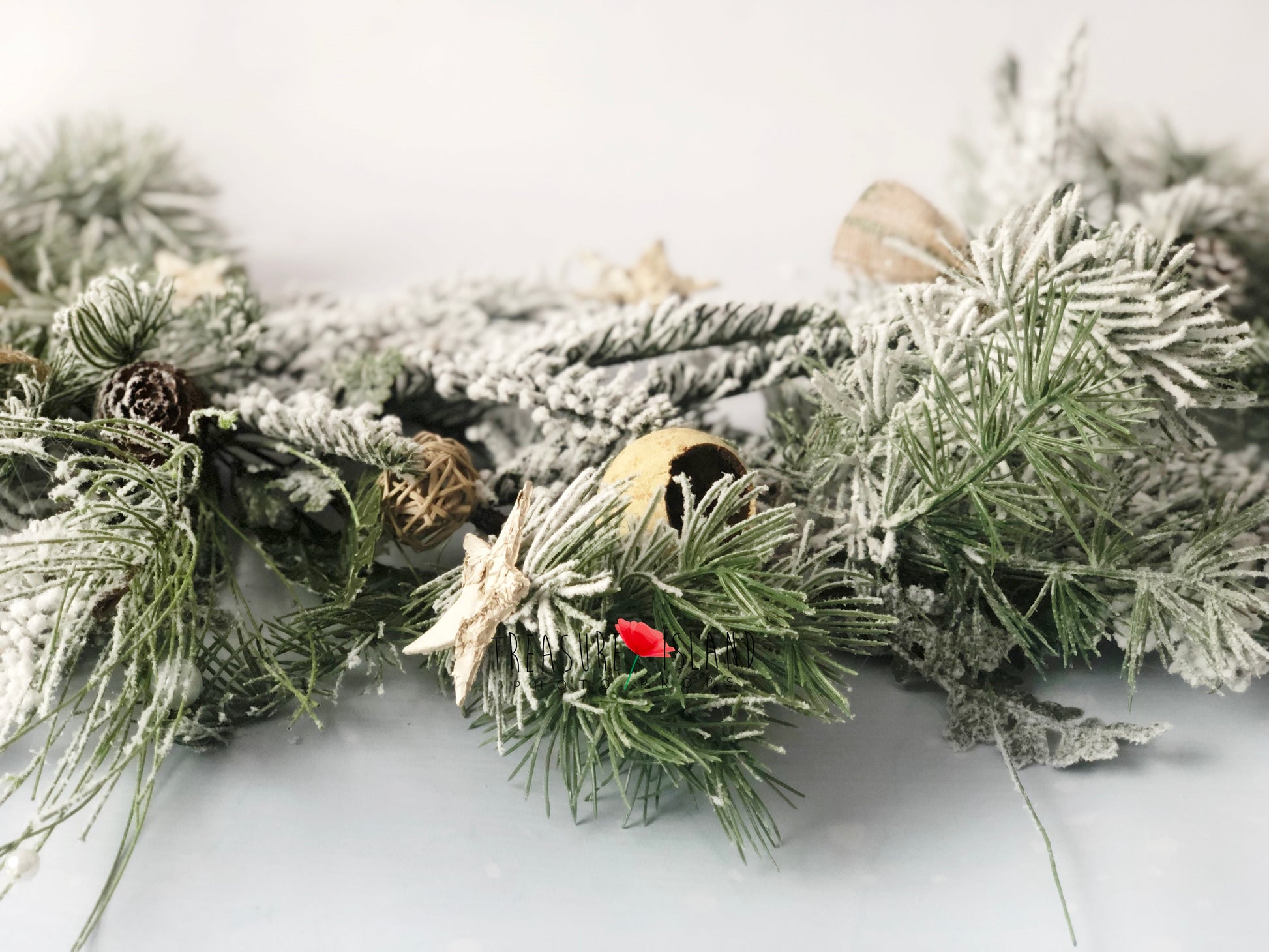 Luxury winter garland with mixed snowy greenery, pinecones and natural Christmas details