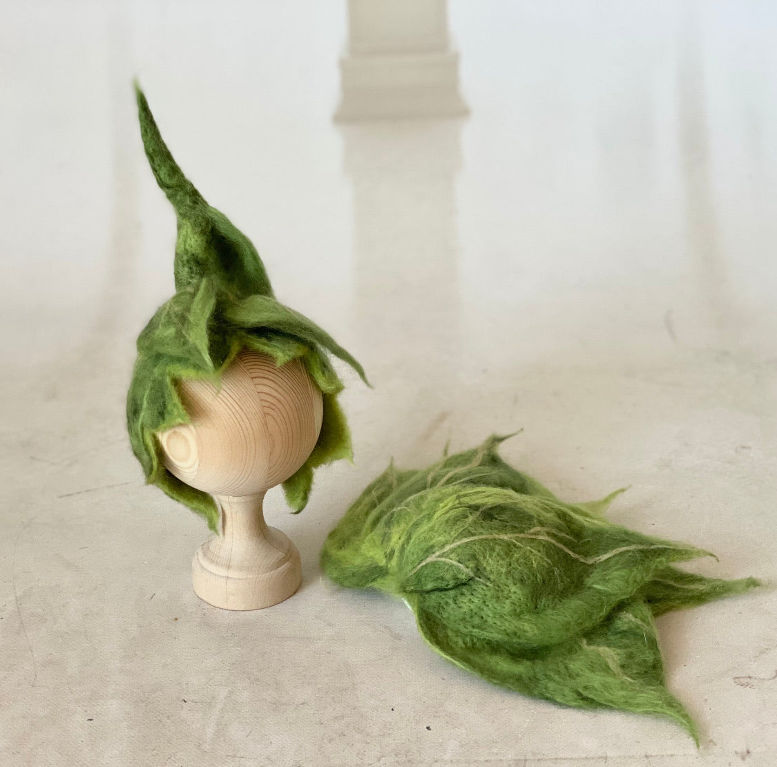 Front view of Woodland Green hand-felted leaf bonnet for newborn photography